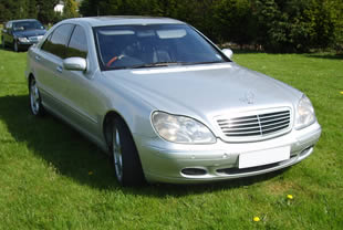 Front and side view of Mercedes wedding car