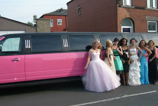 Prom girls pose with pink limo in Blackpool, Lancs