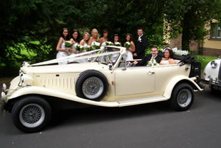 Tourer with bridesmaids standing alongside