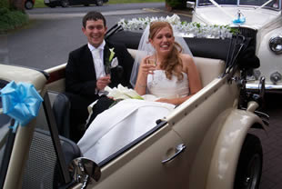 Bride and groom pose in Beauford while drinking Champagne