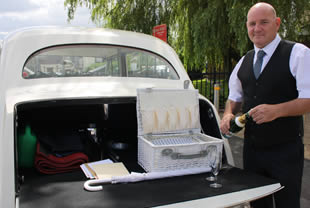 Chauffeur poses with vehicle in Bury (Lancs)