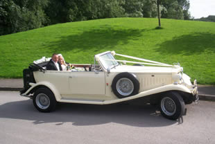 Couple pose together in vehicle